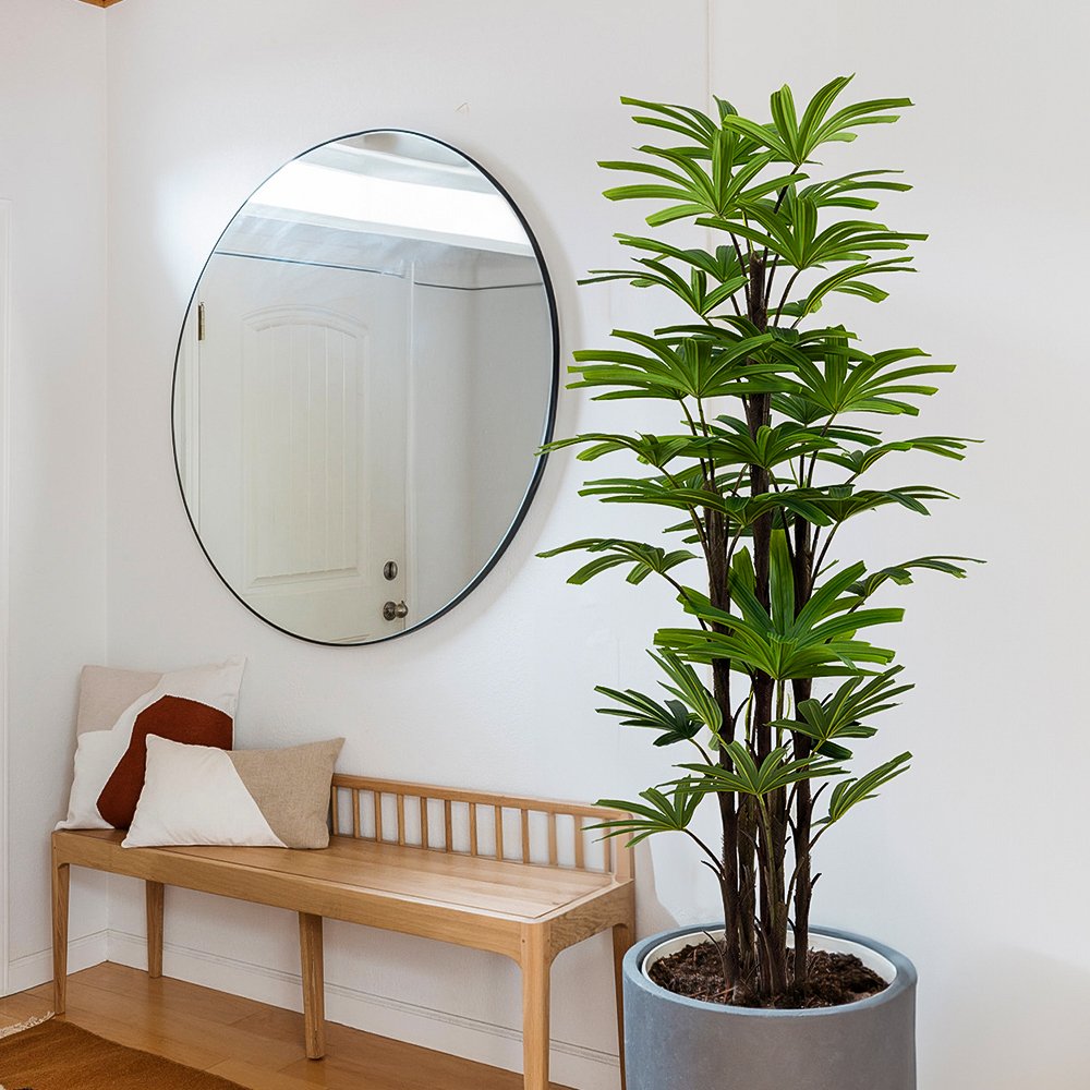 Rhapis Palm Commercial Interior Staging Commercial-grade artificial Lady Palm tree (Rhapis excelsa) with multi-stem textured trunks and lush green fan fronds in a black weighted plastic pot.